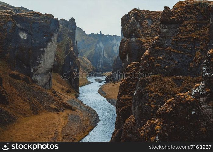 Unique landscape of Fjadrargljufur in Iceland. Top tourism destination. Fjadrargljufur Canyon is a massive canyon about 100 meters deep and about 2 kilometers long, located in South East of Iceland.