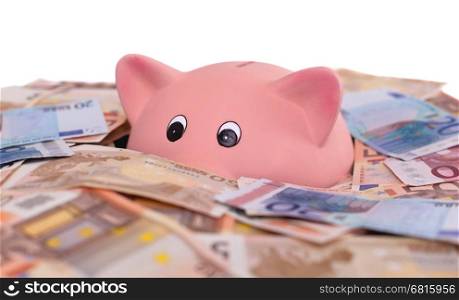 Unique pink ceramic piggy bank drowning in money, isolated on white