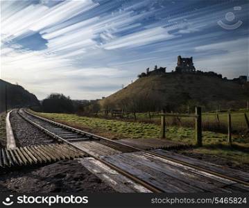 Unique time lapse stack landscape of medieval castle and railway tracks