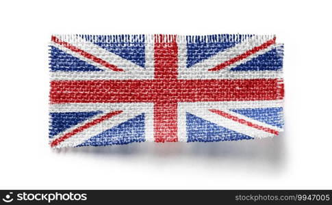 United Kingdom flag on a piece of cloth on a white background.. United Kingdom flag on a piece of cloth on a white background