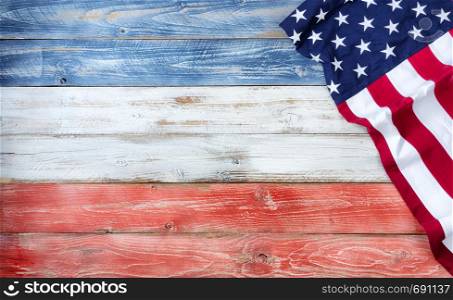 United States flag on red, white and blue rustic wooden boards with plenty of copy space