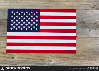 United States of America flag on rustic cedar wood.