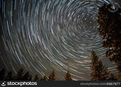 universe spiraling around north star on night sky
