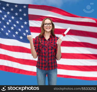 university and education concept - smiling female student in eyeglasses with diploma