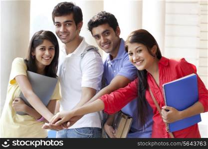 University students stacking their hands