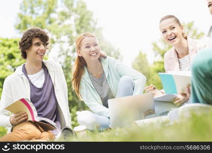 University students studying together on grass