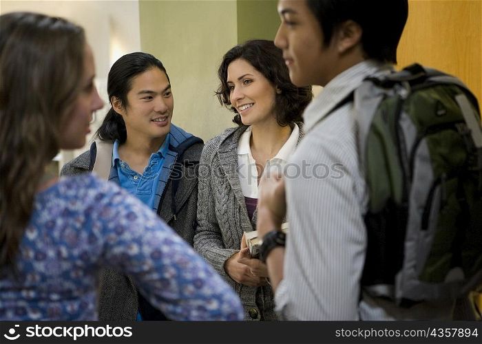University students talking in a corridor