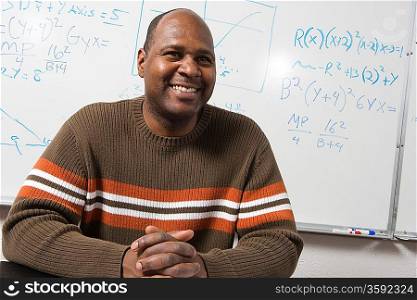 University teacher in classroom, portrait