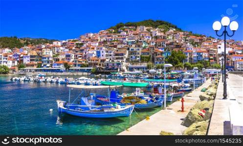Unknown traditional Greece - beautiful Lesvos (Lesbos) island . Plomarion village with fishing boats. Lesvos island, Plomari coastal town. Greece