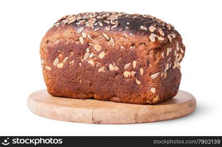 Unleavened bread with seeds on wooden board isolated on white background