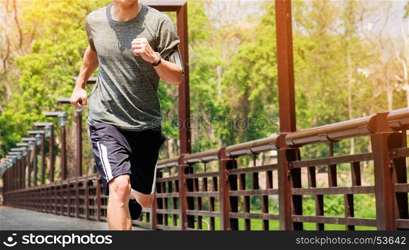unning man. Male runner at sprinting speed training for marathon outdoors.