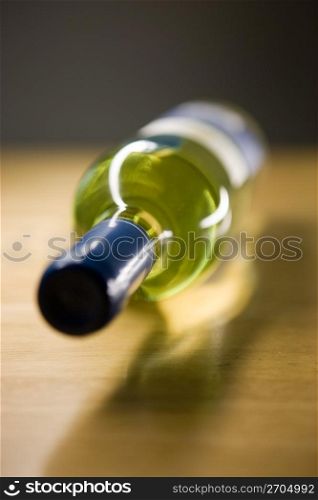 Unopened wine bottle on a wooden table