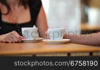 Unrecognisable young women in a cafe