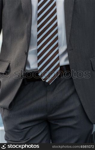 Unrecognizable businessman body closeup