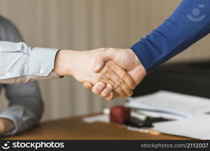 unrecognizable businessmen handshaking