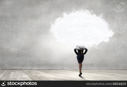 Unrecognizable businesswoman with cloud instead of head