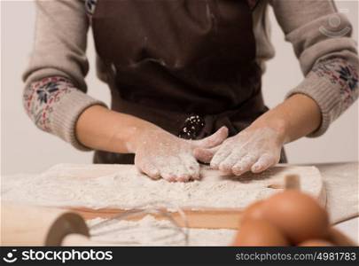 Unrecognizable woman hands cooking dough