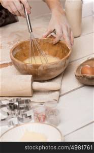 Unrecognizable woman preparing dough, closeup photo