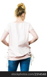Unrecognizable woman presenting her casual beautiful outfit, short sleeved white top and jeans.. Woman wearing casual outfit