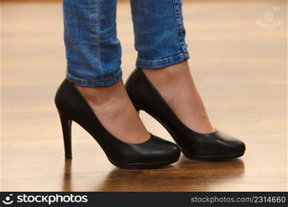 Unrecognizable woman wearing dress or skirt and black elegant fashionable high heels.. Unrecognizable woman wearing high heels
