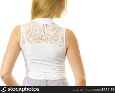 Unrecognizable woman wearing white top with laced detail on back. Fashion, clothing style concept.. Woman wearing white top