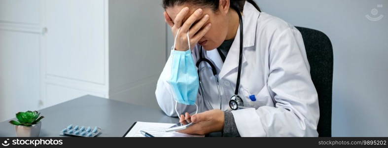 Unrecognizable worried female doctor with hands on face