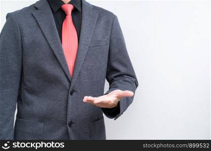 Unrecognize businessman with opened hand on white background