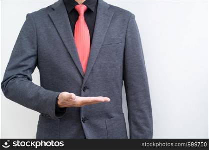 Unrecognize businessman with opened hand on white background