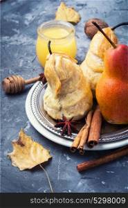 Unusual autumn dessert. Autumnal dessert from pears baked in dough