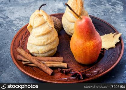 Unusual autumn dessert. Autumnal dessert from pears baked in dough