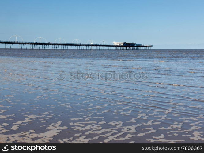 Unusual combination of high tide floods the beach at Southport