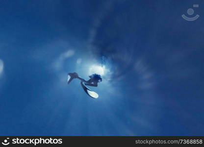 unusual photo diver underwater background