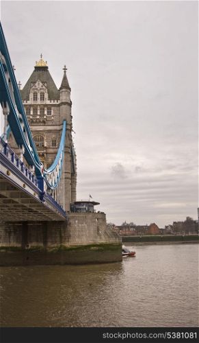 Unusual view of Tower Bridge London against dark moody sky