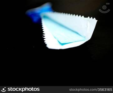 Unwrapped stick of chewing gum isolated on background