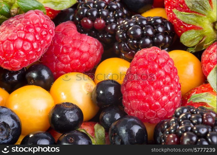 Up Close view of fresh berries of different types, all mixed together.