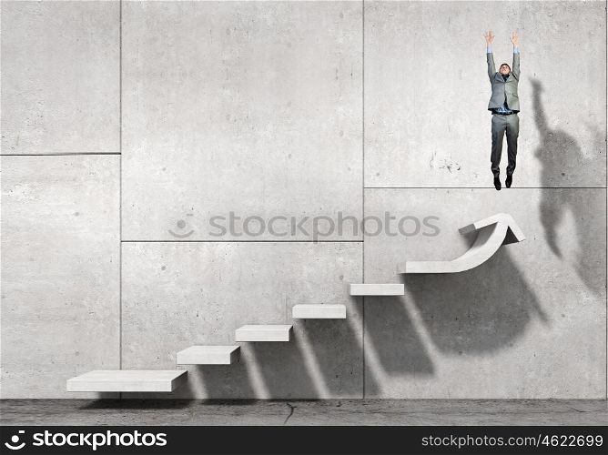 Up the career ladder. Businessman with suitcase jumping up stone staircase