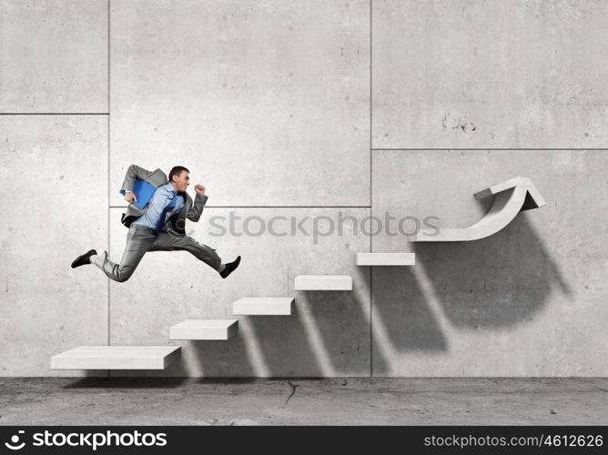 Up the career ladder. Businessman with suitcase running on stone staircase