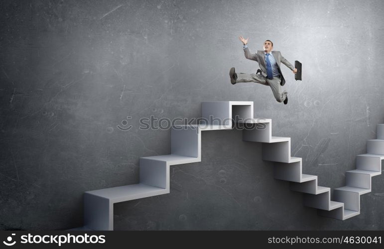 Up the career ladder. Businessman with suitcase running on stone staircase