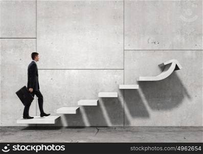 Up the career ladder. Businessman with suitcase stepping up stone staircase