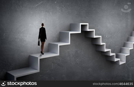 Up the career ladder. Businesswoman with suitcase stepping up stone staircase