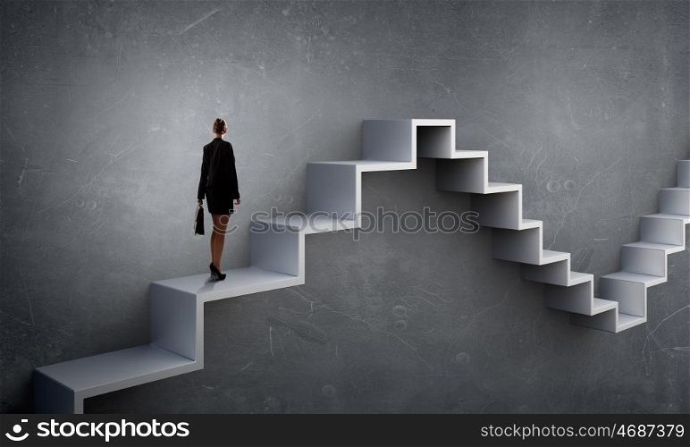 Up the career ladder. Businesswoman with suitcase stepping up stone staircase
