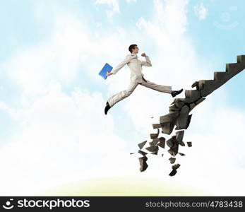 Up the career ladder overcoming challenges. Young businessman walking up collapsing staircase representing success concept