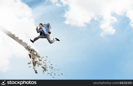 Up the career ladder overcoming challenges. Young businessman walking up collapsing staircase representing success concept