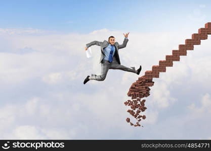 Up the career ladder overcoming challenges. Young businessman walking up collapsing staircase representing success concept