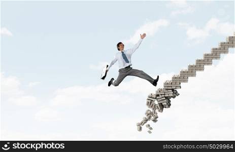Up the career ladder overcoming challenges. Young businessman walking up collapsing staircase representing success concept