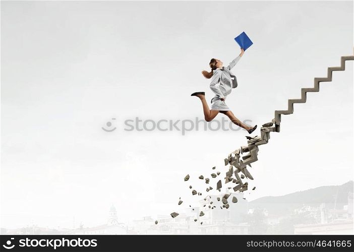 Up the career ladder overcoming challenges. Young businesswoman walking up collapsing staircase representing success concept