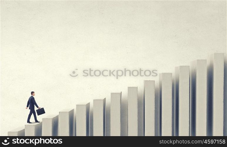 Up the career ladder. Young businessman walking up on bars staircase representing success concept