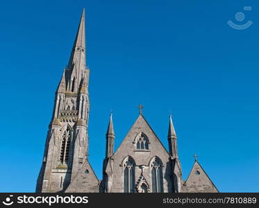 up view of Saint John&rsquo;s cathedral in Limerick, Ireland (blue sky background)