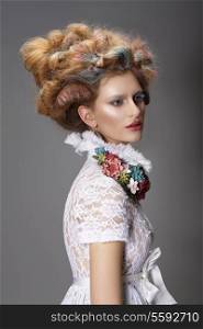 Updo. Dyed Hair. Woman with Modern Hairstyle. High Fashion