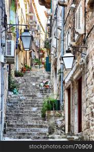 Uphill narrow street in Old town of Dubrovnik, Croatia